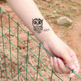 Small ephemeral tattoo (temporary) cute owls with keys, woman